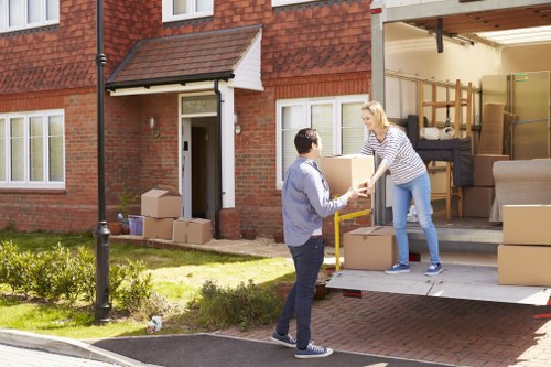 Uk Manandvan van parked outside a terraced house ready to load