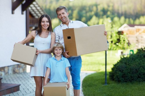 Professional movers handling office equipment